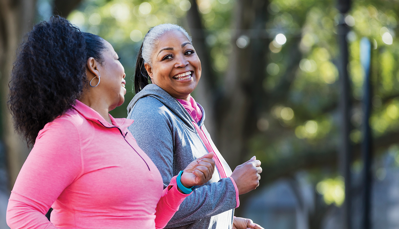 Two women running and smiling